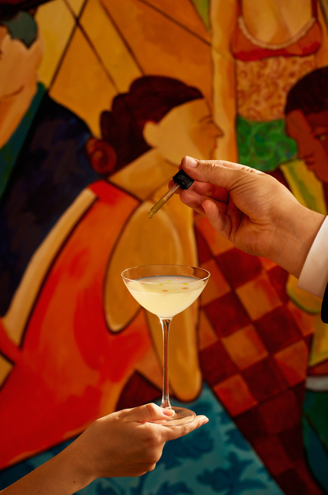 A close-up portrait shot of the 'Mural You Look' cocktail from the Bloomsbury Group cocktail collection at Oscar Bar & Restaurant