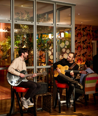 Two guitarists playing at Refuel