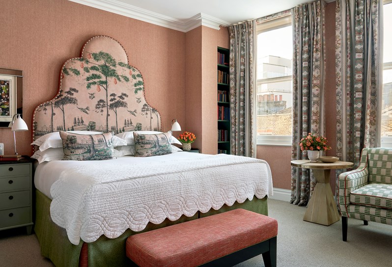A bedroom with a gorgeous tall tree headboard at Charlotte Street Hotel