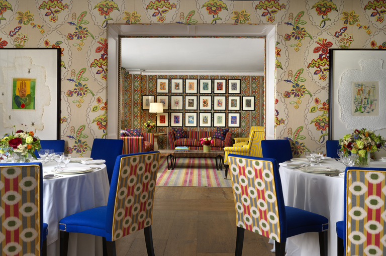 Round dining tables set-up in the Fortune private events room and lounge set up in Lyric room at Covent Garden Hotel