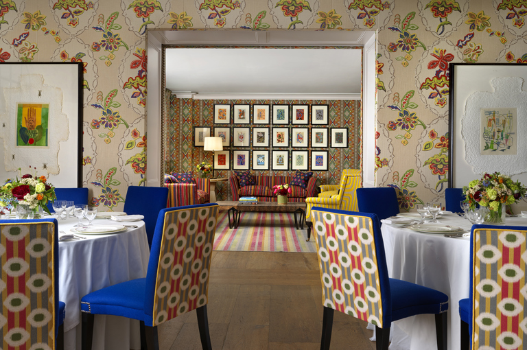 Round dining tables set-up in the Fortune private events room and lounge set up in Lyric room at Covent Garden Hotel