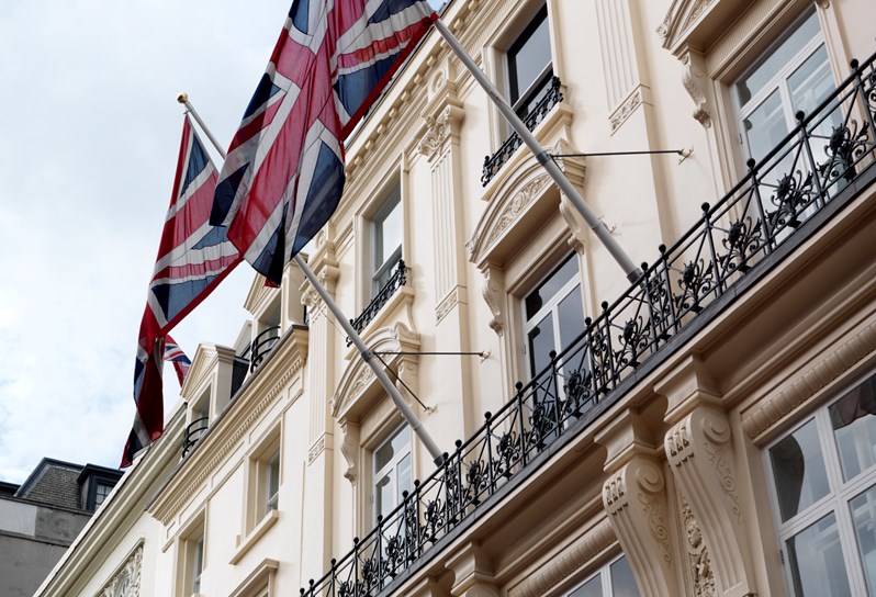 Shot of Haymarket Hotel's entrance and the Union Jack flag.