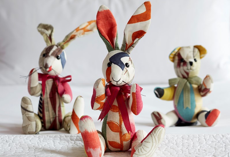 Kit Kemp designs patchwork rabbit. In the background is a patchwork rabbit and bear.