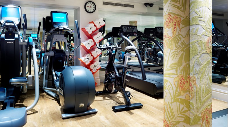 A gym showing 4 exercise machines.