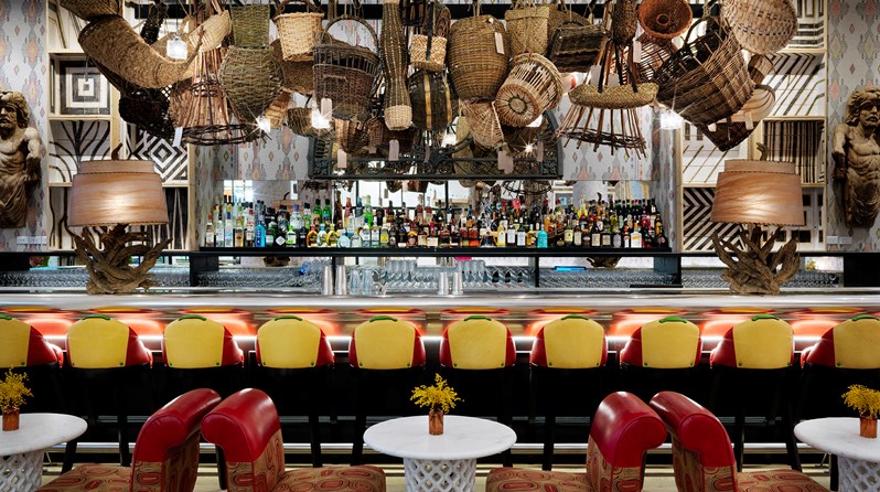 The well renowned 30 foot pewter bar of The Whitby Hotel, crowned with an installation of 52 baskets rooted in local British culture and diversity.