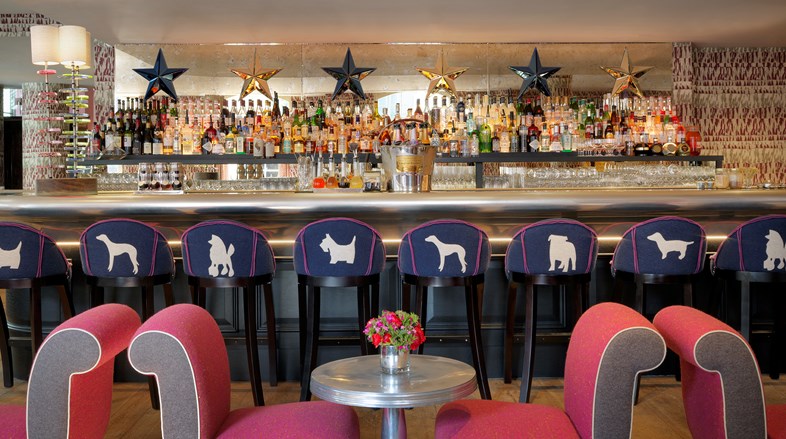A long colourful bar serving with comfortable lounge seating and serving breakfast, lunch, dinner, afternoon tea and cocktails all day long.
