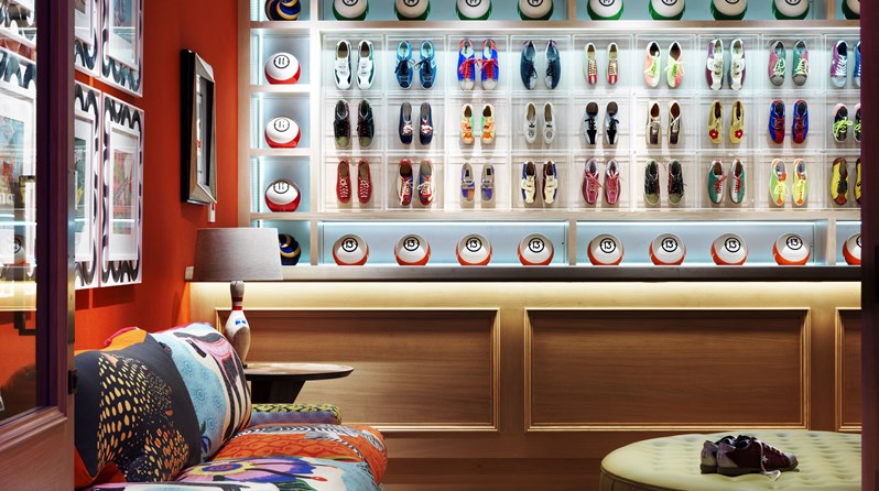 The entry to Croc Bowling Alley, complete with original, colorful bowling shoes and bowling balls on display behind the reception desk.