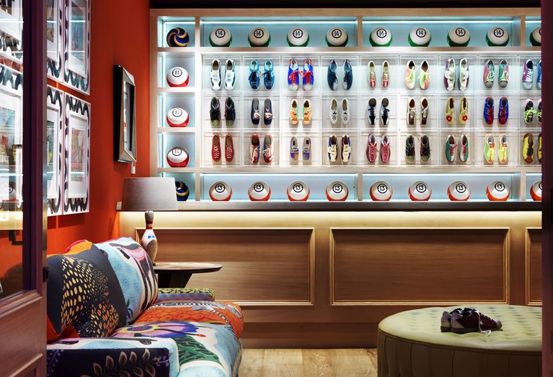 The entry to Croc Bowling Alley, complete with original, colorful bowling shoes and bowling balls on display behind the reception desk.