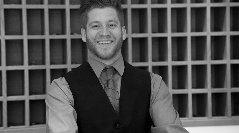 Black and white image of a member of a recpetionist