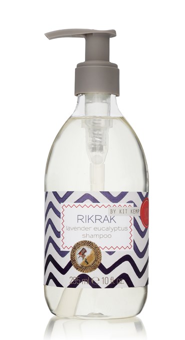 A 295ml plastic bottle of shampoo with pump dispenser scented with Lavender Eucalyptus. Label has a blue rick rack design applied.
