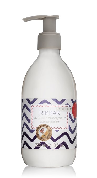 A 295ml plastic bottle of conditioner with pump dispenser scented with Lavender Eucalyptus. Label has a blue rick rack design applied.