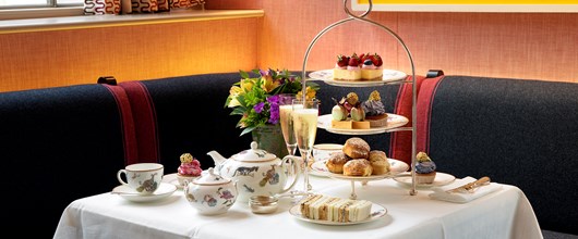 Afternoon tea is served in the colourful Brumus restaurant with Kit Kemp for Wedgwood Mythical Creatures china, Champagne and a delicious selection of cakes, tarts and finger sandwiches.