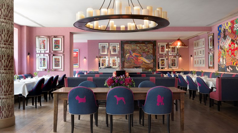Dining tables beautifully set in Brumus restaurant serving breakfast, lunch, afternoon tea and dinner all day long, surrounded by vibrant interiors and original artwork.