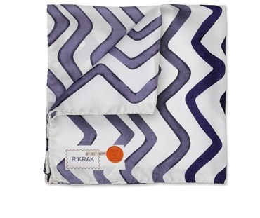 Partially folded hand made silk pocket square in Kit Kemp's Rick Rack design for Christopher Farr. In the colour Indigo.