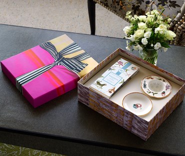 Kit Kemp for Wedgwood. A Mythical Creatures tea strainer and packet of tea in a colourful presentation box.