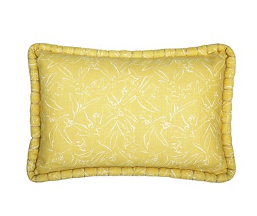 Kit Kemp for Christopher Farr. A rectangular linen cushion in Kit Kemp's Inside Out design in the colour lemon. The cushion's base is lemon and has leafy motifs in white.