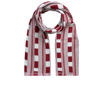 Kit Kemp for Christopher Farr. A long scarf in ruby red and cream lines interrupted by alternating boxes and dotted red and white lines. produced using Kit Kemp's Lost and found fabric.