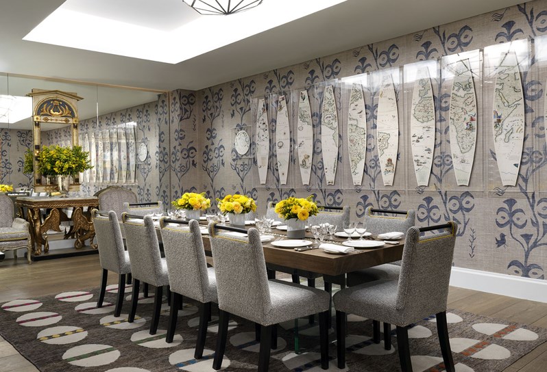 Lafayette Private dining room set up for lunch with a row of bright yellow flowers down the centre, beautiful china and glassware and line walls with a pretty graphic pattern.