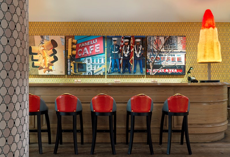 The Events floor lobby with colourful wallpapers and art with a graphic colourful floor rug.