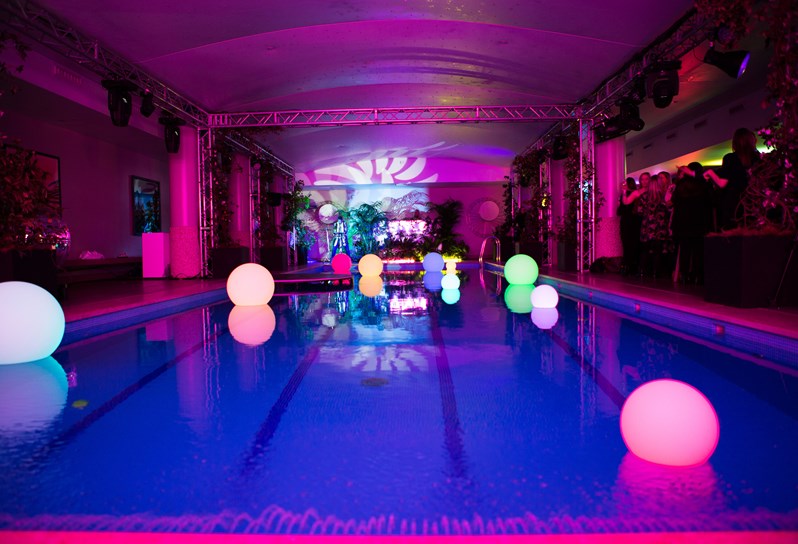 A wedding party in full swing in the pool area at Haymarket Hotel