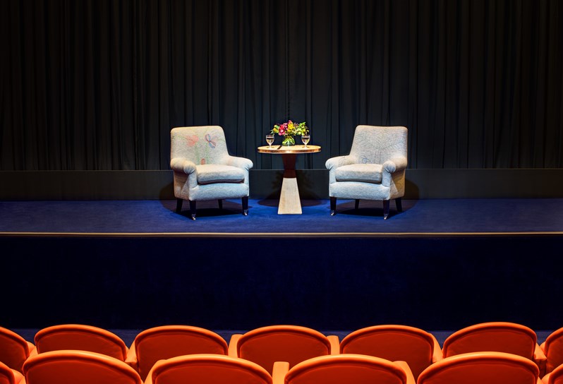 Two chairs at the front of the screening room with seats in the foreground