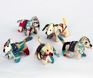 Five Mr Fizz patchwork key rings covered in several of the colourful off cuts of Kit Kemp's fabric designs.