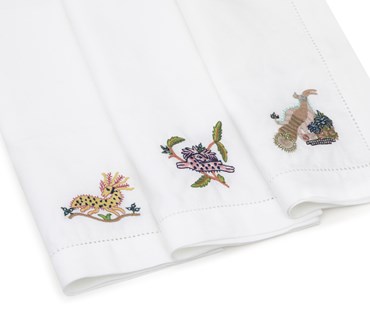 3 Mythical Creatures linen placemats in the different embroidered designs.