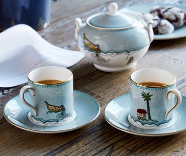 Kit Kemp for Wedgwood. Sailor's Farewell espresso coffee cup and saucer, crafted in fine white bone china are decorated in the whimsical characters from Kit Kemp’s illustrative story of The Sailor’s Farewell, showing sugar bowl in background