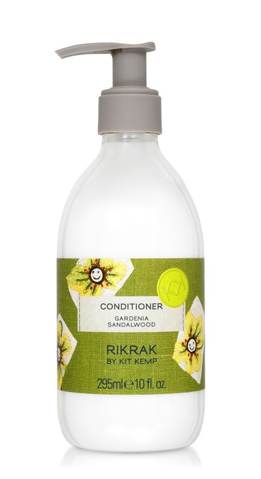 A 295ml plastic bottle of conditioner with pump dispenser scented with Gardenia Sandalwood. Label has a green friendly flowers design applied.
