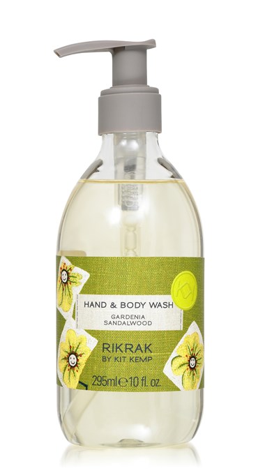 A 295ml plastic bottle of hand and body wash with pump dispenser scented with Gardenia Sandalwood. Label has a green friendly flowers design applied.