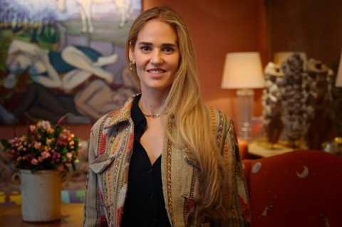 A close up shot of Firmdale Art Ambassador and Design Director Willow Kemp standing in the Drawing Room at Ham Yard Hotel