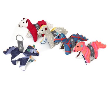 Five Mr Puff patchwork soft toys covered in several of the colourful off cuts of Kit Kemp's fabric designs