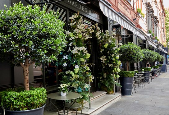 Covent Garden Hotel exterior with floral installation outside