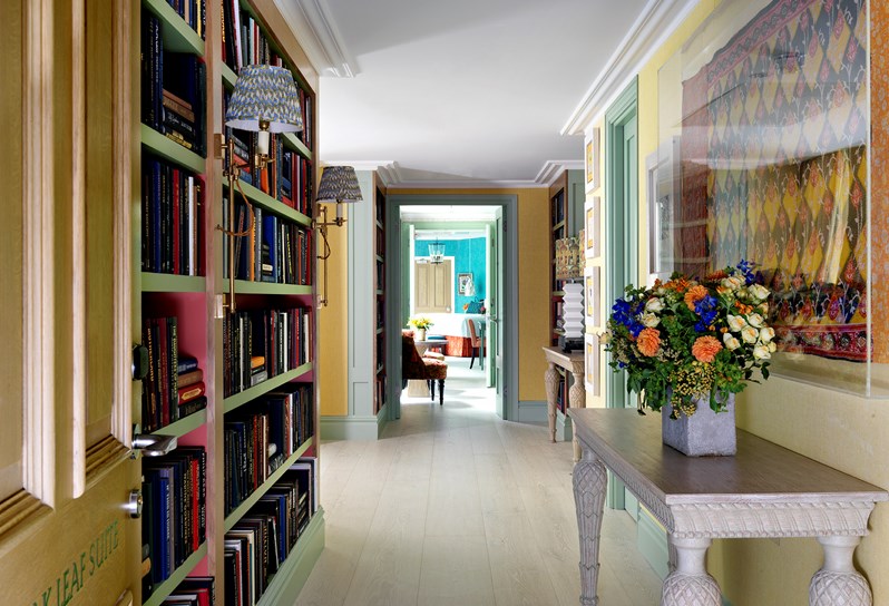 Looking down a hallway lined with bookshelves