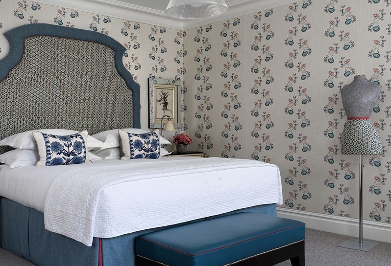 a blue floral bedroom at The Soho Hotel