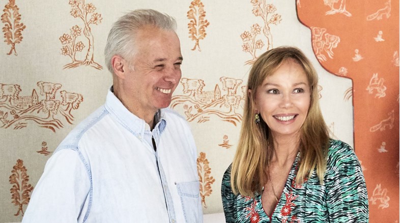 Kit Kemp and Martin Waller in front of a white headboard