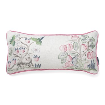 Face on shot of this cushion made with Kit's Hedgerow Cerise fabric, a patchwork style motif showing the playful faces of mythical creatures prancing between abundant fruit trees with contrast cerise piping.