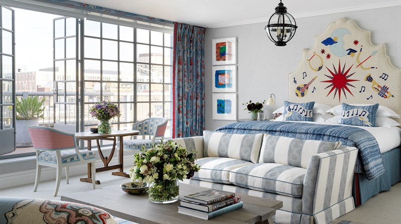 A light and spacious suite with floor to ceiling Crittall windows. There is a king size bed with a statement embroidered headboard