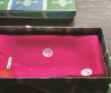 Pink Over the moon pocket square folded inside gift box, featuring Kit Kemp's Ozone green fabric