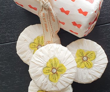 4 x Large soaps on a wooden table