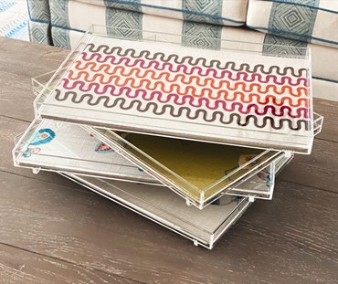 Stacked trays on a side table