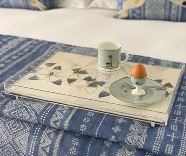 Daisy Chain tray on bed with Sailors crockery placed on top