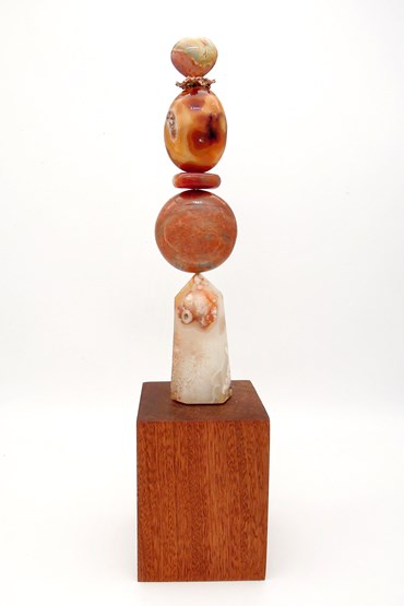TOTEM 36 is entirely unique made from the following precious crystal stones:
From the top – Polychrome Jasper Heart, raw Copper, 2 x Carnelian, Peach Moonstone and a Flower Agate point. The stones are supported on a central support sitting on a sapele wood base.