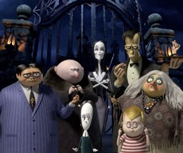 The Addams Family standing in front of the gates - link to The Addams Family