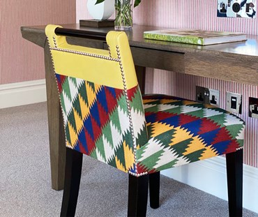 Handle chair in jester fabric showing back with nickel studs