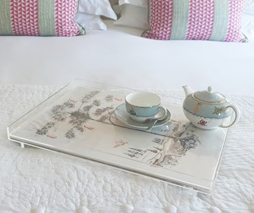 Acrylic tray with Andrew Martin Dusk fabric - placed on a bed