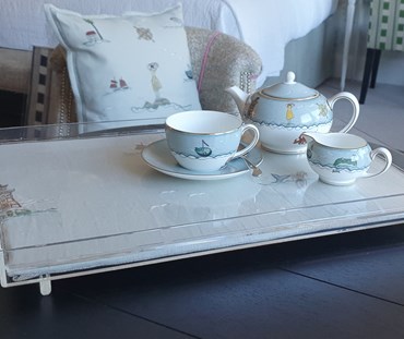 Acrylic tray with hand embroidered sailors farewell linen - sailors farewell china placed on the tray