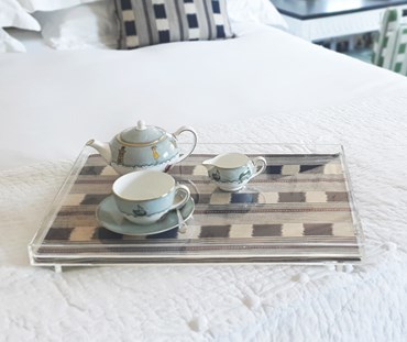 Acrylic tray on the bed - made using 100% lost and found fabric - Sailors Farewell china placed on the tray