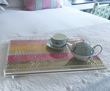 Acrylic tray - made with 100% linen hot pink bookends fabric - tray placed on the bed with Sailors farewell crockery