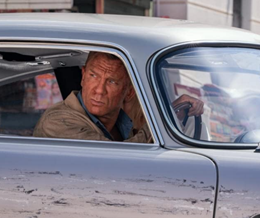 A scene from No Time to Die showing Daniel Craig inside a car - link to No Time to Die